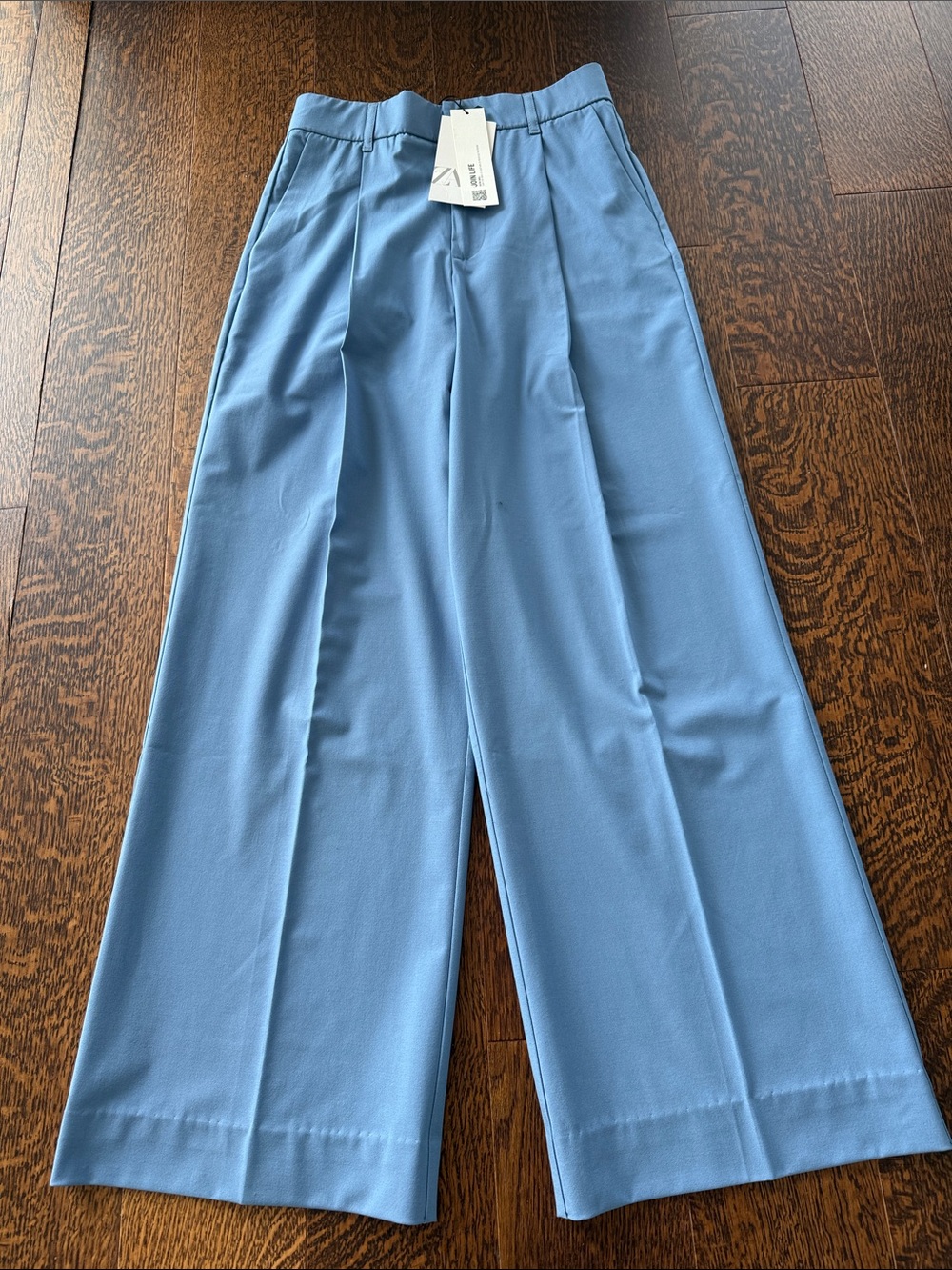 Women tailor wide leg pants inspired by men’s wear